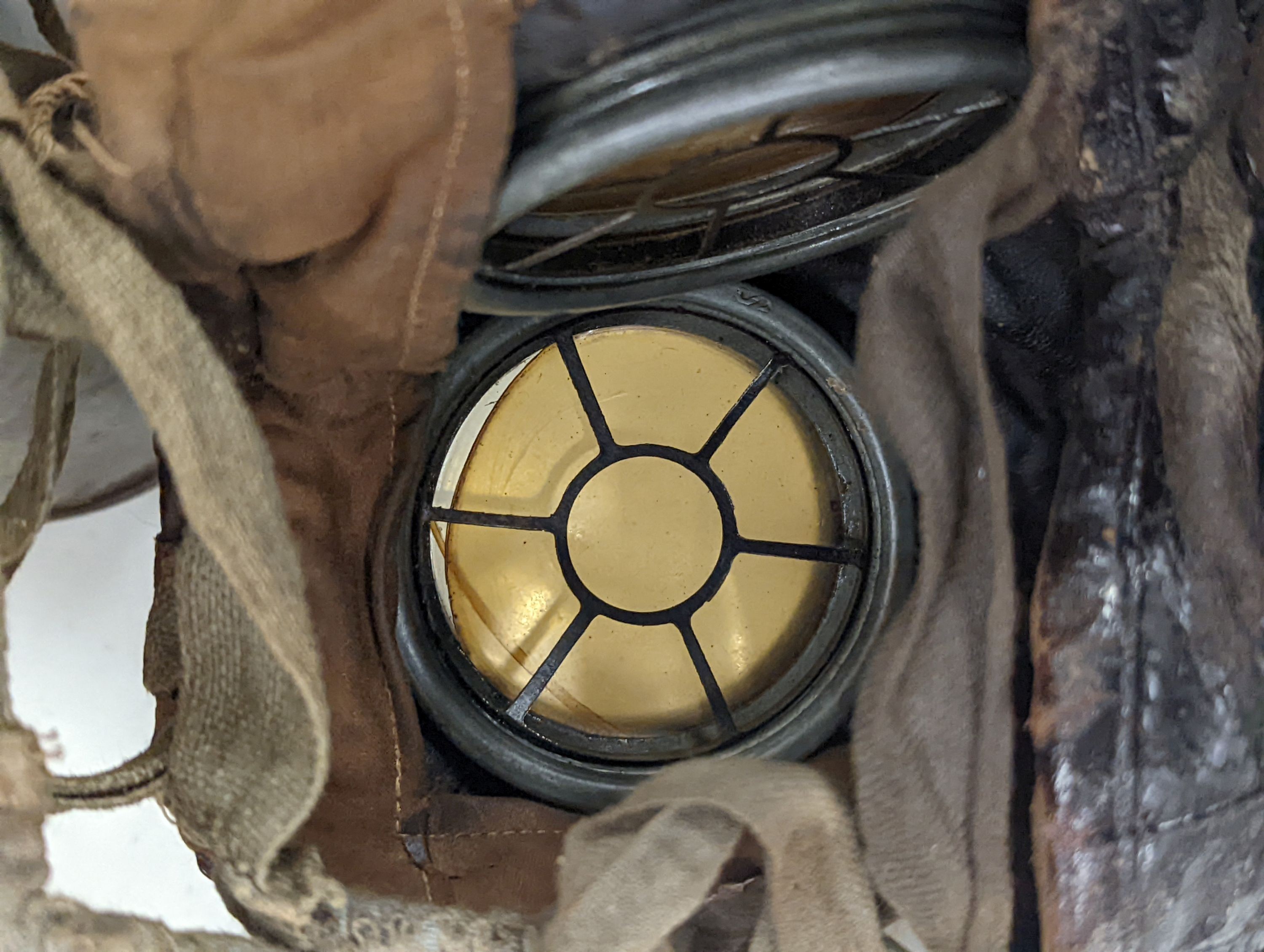 WWI German gas mask, two German trench mess tins and a German leather belt case